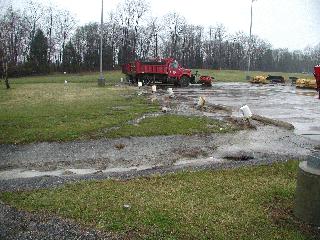 Runoff from the parking lot at the Monroe County Highway Garage prior to rain garden installation.